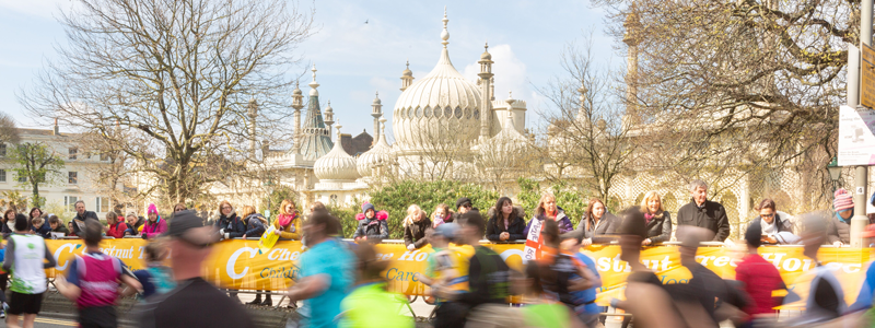 Runners pass the Royal Pavillion in Brighton